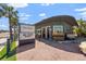 Charming gray brick restaurant called The Helm has outdoor patio seating and an inviting sign to honk if you love it at 437 79Th Ave, St Pete Beach, FL 33706