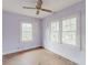 Simple bedroom with natural light from dual windows, ceiling fan, and hardwood flooring at 8226 36Th N Ave, St Petersburg, FL 33710