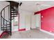 Unique bedroom with exposed ceiling fan, spiral staircase, unfinished walls, and natural hardwood floors at 8226 36Th N Ave, St Petersburg, FL 33710