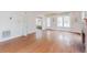 Bright living room featuring hardwood floors, fireplace, and a doorway to another room at 8226 36Th N Ave, St Petersburg, FL 33710