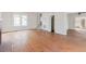 Spacious living room with hardwood floors, fireplace, and natural light from several windows at 8226 36Th N Ave, St Petersburg, FL 33710