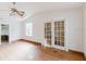 Large living room featuring hardwood floors, many windows, and doors leading to other rooms at 8226 36Th N Ave, St Petersburg, FL 33710