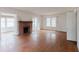 Spacious living room featuring hardwood floors and a classic brick fireplace at 8226 36Th N Ave, St Petersburg, FL 33710