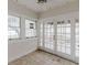 Sunroom featuring many windows and doors to outside porch at 8226 36Th N Ave, St Petersburg, FL 33710