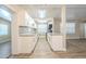 Modern kitchen features white cabinets, subway tile backsplash, and granite counters at 3720 E Idlewild Ave, Tampa, FL 33610