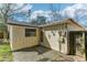 A view of the home's exterior and backyard with a fenced-in perimeter at 4046 Las Vegas Dr, New Port Richey, FL 34653