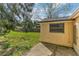 The property's partially fenced backyard and lush grass areas at 4046 Las Vegas Dr, New Port Richey, FL 34653