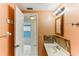 Bathroom with a sink and an open doorway to a bedroom at 4046 Las Vegas Dr, New Port Richey, FL 34653