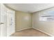 Bedroom with a window and doorway, showing neutral walls and carpeted floor at 4046 Las Vegas Dr, New Port Richey, FL 34653