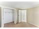 Bedroom showcasing a bi-fold closet and an open doorway to another room at 4046 Las Vegas Dr, New Port Richey, FL 34653