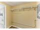 Good sized closet with wooden floors and wire shelving, with electrical panel access at 4046 Las Vegas Dr, New Port Richey, FL 34653