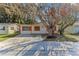 Charming single-story home with a well-maintained front yard and a concrete driveway at 4046 Las Vegas Dr, New Port Richey, FL 34653
