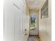 Hallway entrance to the home with an exterior door and a window looking out onto the yard at 4046 Las Vegas Dr, New Port Richey, FL 34653