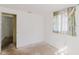 Bedroom featuring a doorway and a window, ready for a personalized update at 1825 134Th St, Largo, FL 33778