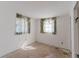 Bedroom featuring two windows offering natural light, ready for a personalized update at 1825 134Th St, Largo, FL 33778