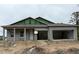 Unfinished single-story home with two-car garage and covered entry in a construction zone at 2994 Alesio Ave, North Port, FL 34286