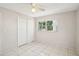 Bedroom featuring sliding closet and large window providing outdoor views at 4594 Essex Ln, Spring Hill, FL 34606