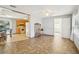 Open-concept living area featuring tile flooring and views into the connected kitchen at 4594 Essex Ln, Spring Hill, FL 34606