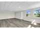 Spacious bonus room with new flooring, a modern ceiling, and ample natural light at 5417 1St St, Bradenton, FL 34203