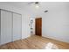 Comfortable bedroom with hardwood floors, a ceiling fan, and closet space at 8608 N 20Th St, Tampa, FL 33604
