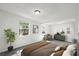 Spacious bedroom with ample natural light, neutral carpet, and modern decor at 8608 N 20Th St, Tampa, FL 33604