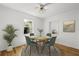 Bright dining area with hardwood floors and a window overlooking lush greenery at 8608 N 20Th St, Tampa, FL 33604