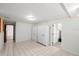Spacious living room with tile flooring and convenient access to additional rooms at 8608 N 20Th St, Tampa, FL 33604