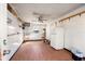 Shed interior with AC, shelves and a refrigerator, offering additional storage at 8608 N 20Th St, Tampa, FL 33604