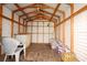 Shed interior with wooden beams, white walls, and plenty of storage space at 8608 N 20Th St, Tampa, FL 33604