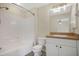 Bathroom featuring a shower-tub combo, nice vanity, and neutral paint at 7280 Meroni Blvd, North Port, FL 34291