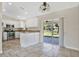 Modern kitchen featuring stainless steel appliances, white cabinets, and a breakfast bar at 7280 Meroni Blvd, North Port, FL 34291