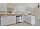Modern kitchen featuring granite countertops, stainless steel appliances, and ample cabinetry at 7280 Meroni Blvd, North Port, FL 34291