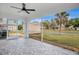 Enjoy this screened patio with an outdoor ceiling fan and great views of the backyard at 7280 Meroni Blvd, North Port, FL 34291