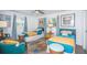 Bedroom with two twin beds and a colorful rug at 1825 Alberta Dr, Clearwater, FL 33756
