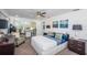 Bright bedroom with large windows, comfortable seating area, and ample closet space at 1825 Alberta Dr, Clearwater, FL 33756
