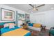 Bedroom with two twin beds, ceiling fan, and a closet at 1825 Alberta Dr, Clearwater, FL 33756