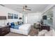 Bright bedroom with large windows, comfortable seating area, and ample closet space at 1825 Alberta Dr, Clearwater, FL 33756