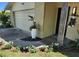 Beautiful landscaping and flowerbeds accent the front entrance with a lovely curb appeal at 1825 Alberta Dr, Clearwater, FL 33756