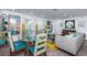 Bright living room and dining room with hardwood floors, modern decor, and ample natural light at 1825 Alberta Dr, Clearwater, FL 33756