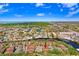 Aerial view of a condo complex near a waterway and tranquil community, surrounded by lush landscaping at 5729 Baywater Dr # 5729, Tampa, FL 33615