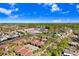 Aerial of condos nestled in a tree-lined community, showcasing serene ponds and nearby neighborhood at 5729 Baywater Dr # 5729, Tampa, FL 33615