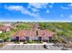 Overhead view of a condo complex surrounded by palm trees, lush landscaping, and a visitor parking lot at 5729 Baywater Dr # 5729, Tampa, FL 33615