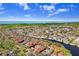 Expansive aerial view of waterfront community featuring lush greenery, waterways, and condo complexes at 5729 Baywater Dr # 5729, Tampa, FL 33615