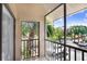 Screened balcony with a view of lush palm trees and manicured landscaping at 5729 Baywater Dr # 5729, Tampa, FL 33615