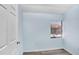 Well-lit bedroom with wood flooring and a window overlooking the community at 5729 Baywater Dr # 5729, Tampa, FL 33615