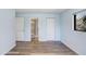 Neutral bedroom with wood flooring and en suite bath at 5729 Baywater Dr # 5729, Tampa, FL 33615