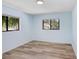 Well-lit bedroom with wood flooring and natural light at 5729 Baywater Dr # 5729, Tampa, FL 33615