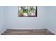 Neutral bedroom with wood flooring and natural light at 5729 Baywater Dr # 5729, Tampa, FL 33615