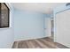 Bedroom with wood flooring, closet, and view to the dining area at 5729 Baywater Dr # 5729, Tampa, FL 33615