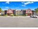 Condo complex featuring a colorful exterior design, screened-in balconies, and well-kept grounds at 5729 Baywater Dr # 5729, Tampa, FL 33615